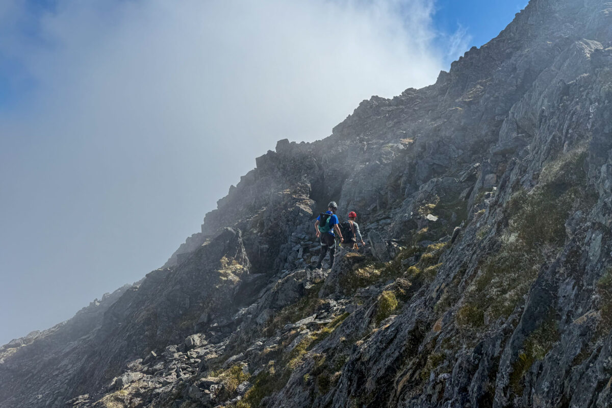 Dropping to a gully to ski an exposed section of crummy rock.